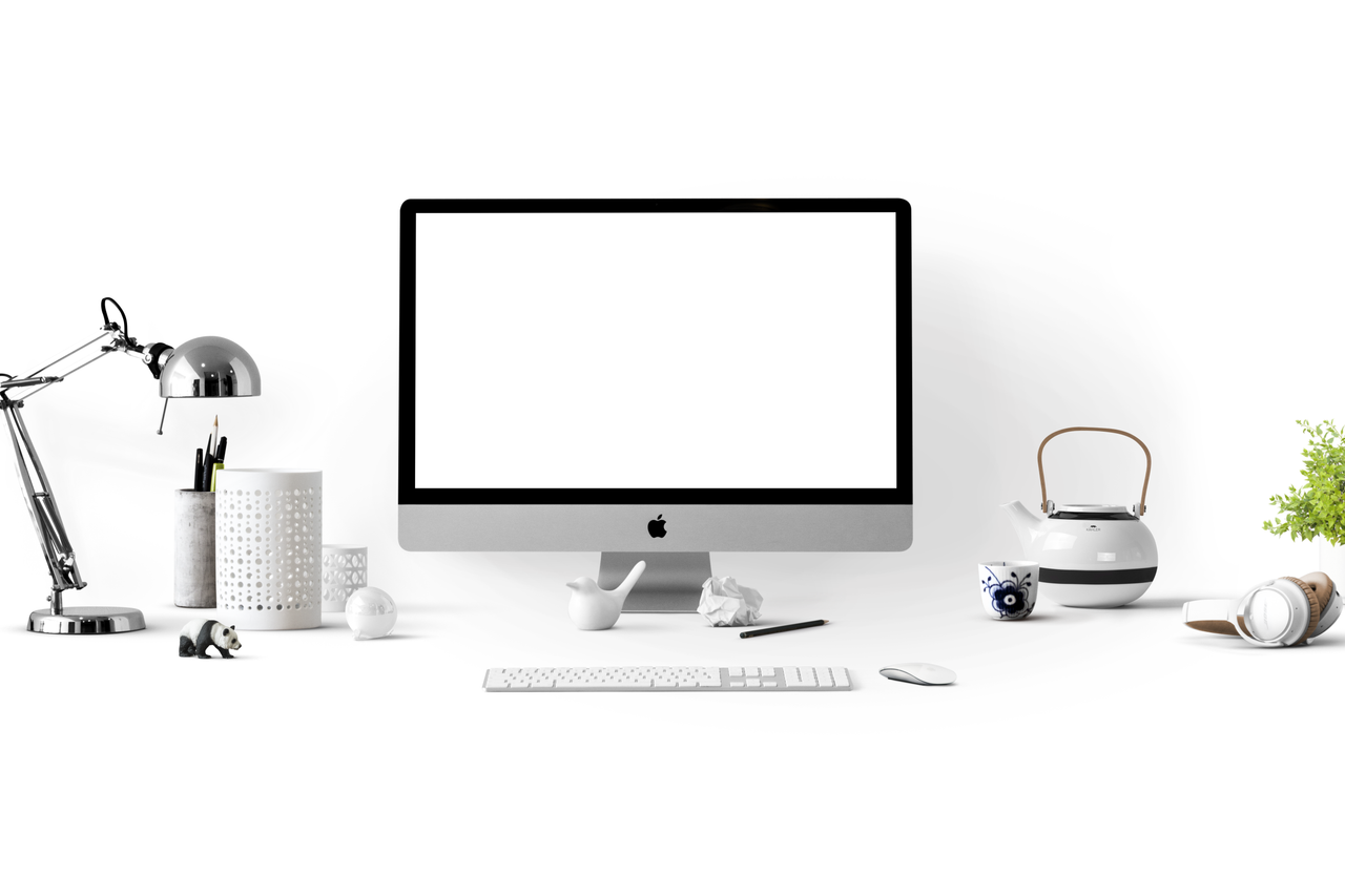brand-02 A minimalist office desk featuring an iMac, lamp, and stationery, ideal for technology-themed backgrounds.